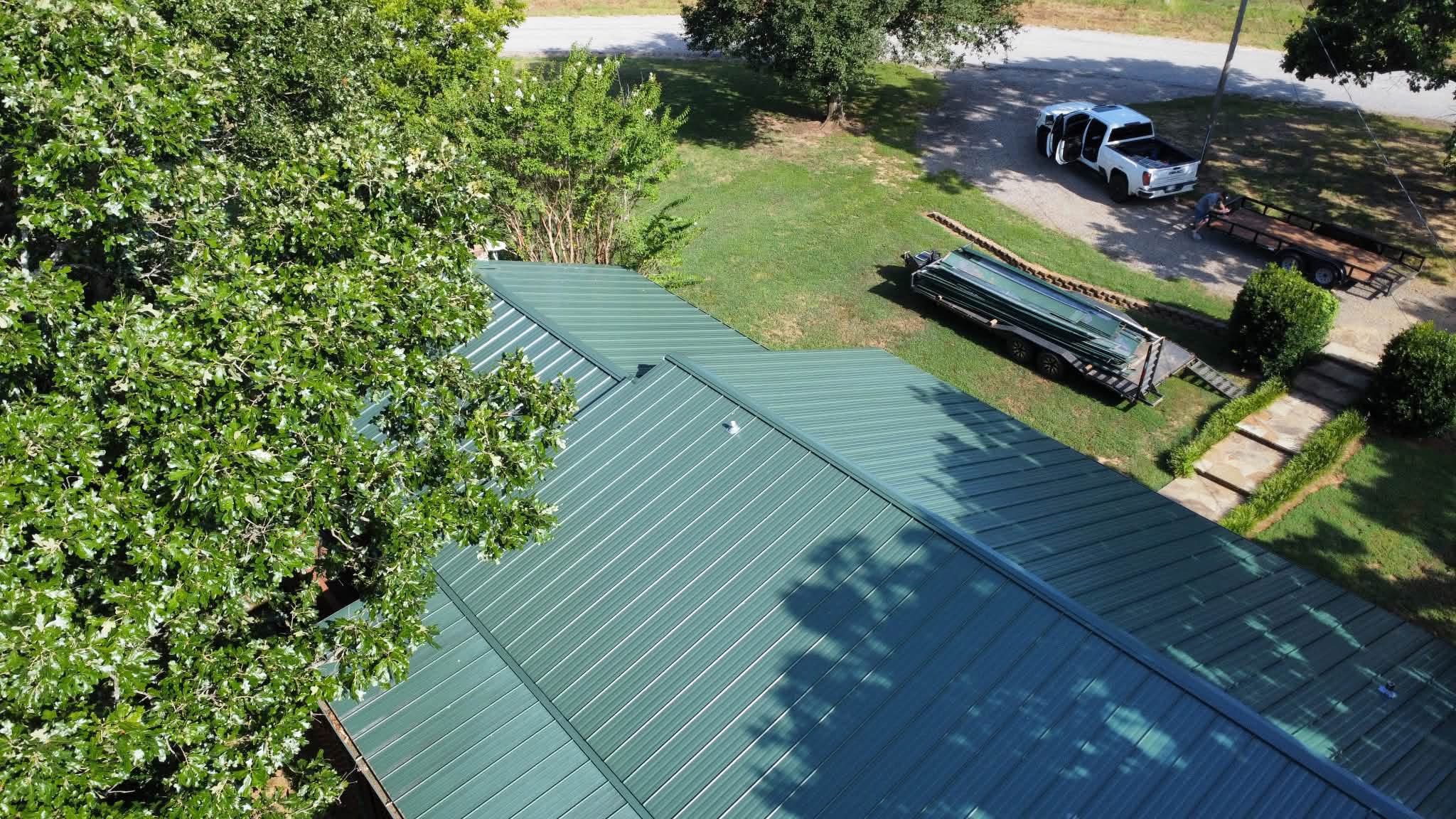 Green metal roofing project aerial view
